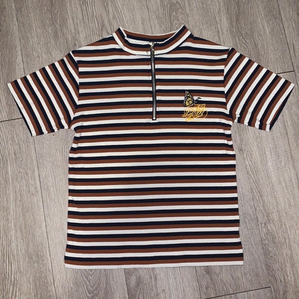 A Zumiez Santa Cruz shirt with a Monarch butterfly.
